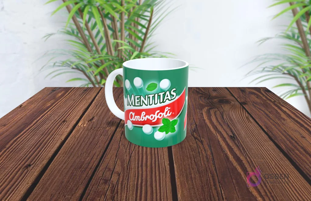 Taza de sublimación con diseño de Mentitas Ambrosoli, color verde, burbujas blancas y hojas de menta.