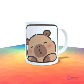 Taza blanca con un capibara dormido o relajado dentro de un recuadro blanco.