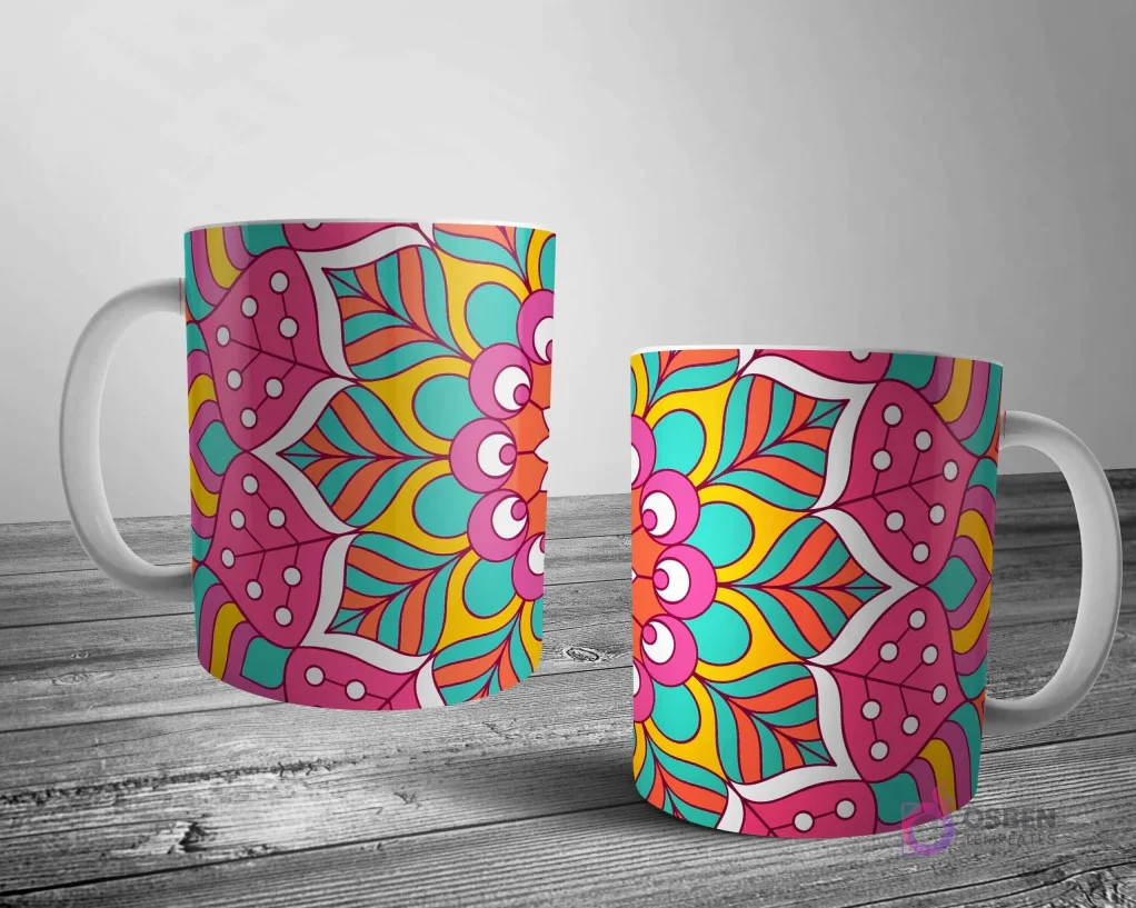 Dos tazas blancas con un diseño de mandala brillante y dinámico en rosa, teal, naranja y amarillo, creando un patrón simétrico y energético.
