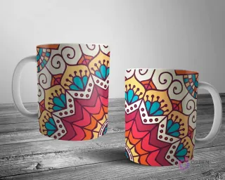 Dos tazas blancas con un diseño de mandala rico y terroso, con elementos florales y geométricos en tonos cálidos de naranja, rojo, amarillo y teal.