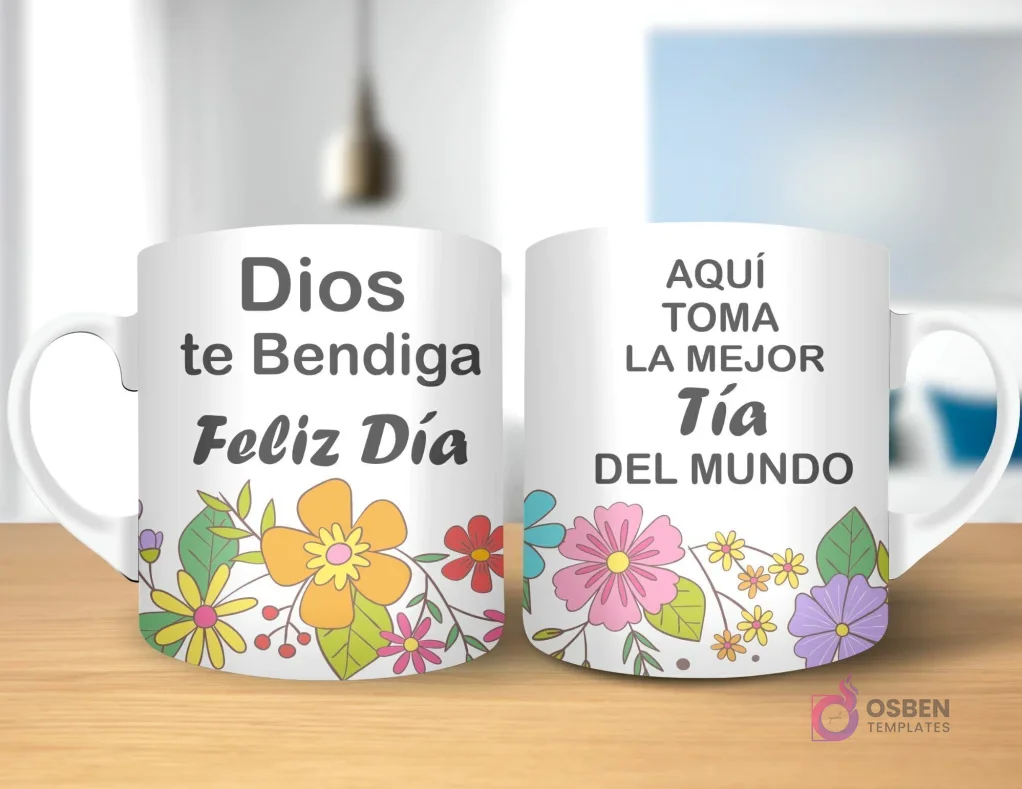 Taza de sublimación con diseño floral, texto 'Dios te Bendiga Feliz Día' y 'AQUÍ TOMA LA MEJOR Tía DEL MUNDO' con asa blanca.