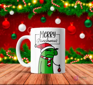 Taza de sublimación blanca con Flork verde disfrazado de Grinch con gorro de Santa y corbata, sosteniendo un adorno rojo, texto 'Merry Grinchmas' con fondo navideño rojo.