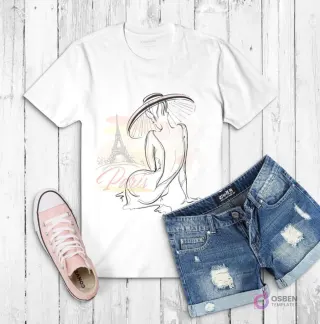 Polera blanca con dibujo de una mujer sentada de espaldas con sombrero de ala ancha, y la Torre Eiffel de fondo con acuarela