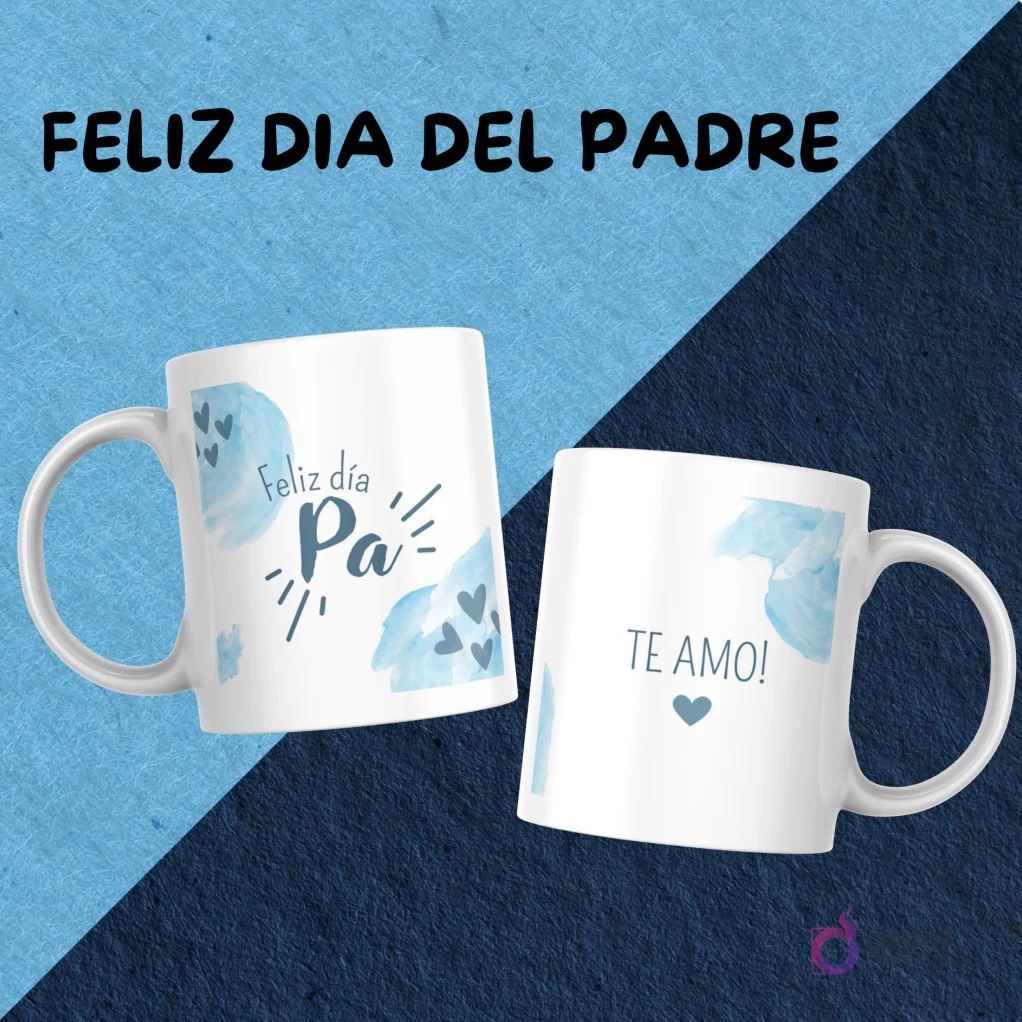 Dos tazas blancas mostrando diseños de sublimación complementarios: una con 'Feliz día Pa' y la otra con 'Te amo!', con motivos de corazones azules claros.