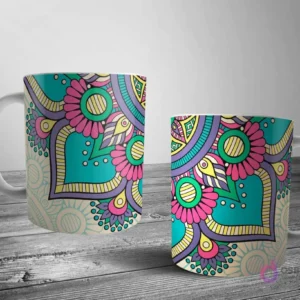 Dos tazas blancas con un alegre diseño de mandala floral y geométrico en teal, rosa, morado y amarillo, sobre un fondo beige claro.