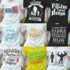 Grid de 9 diseños de playeras para sublimación del Día del Padre con frases como 'PADRE #1', 'Mi Padre es mi Héroe' y 'SOY UN PADRE ORGULLOSO'.