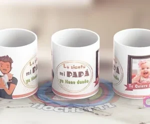 Tazas sublimadas para el Día del Padre con un toque humorístico: una con ilustración de papá y bebé, otra con el texto 'Lo siento mi PAPÁ ya tiene dueño', y una con marco de foto de bebé y mensaje 'Te Quiero Papá'.