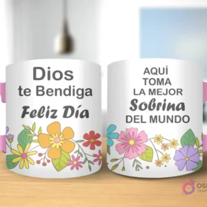 Taza de sublimación con diseño floral, texto 'Dios te Bendiga Feliz Día' y 'AQUÍ TOMA LA MEJOR Sobrina DEL MUNDO' con asa rosa.