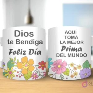 Taza de sublimación con diseño floral, texto 'Dios te Bendiga Feliz Día' y 'AQUÍ TOMA LA MEJOR Prima DEL MUNDO' con asa blanca.
